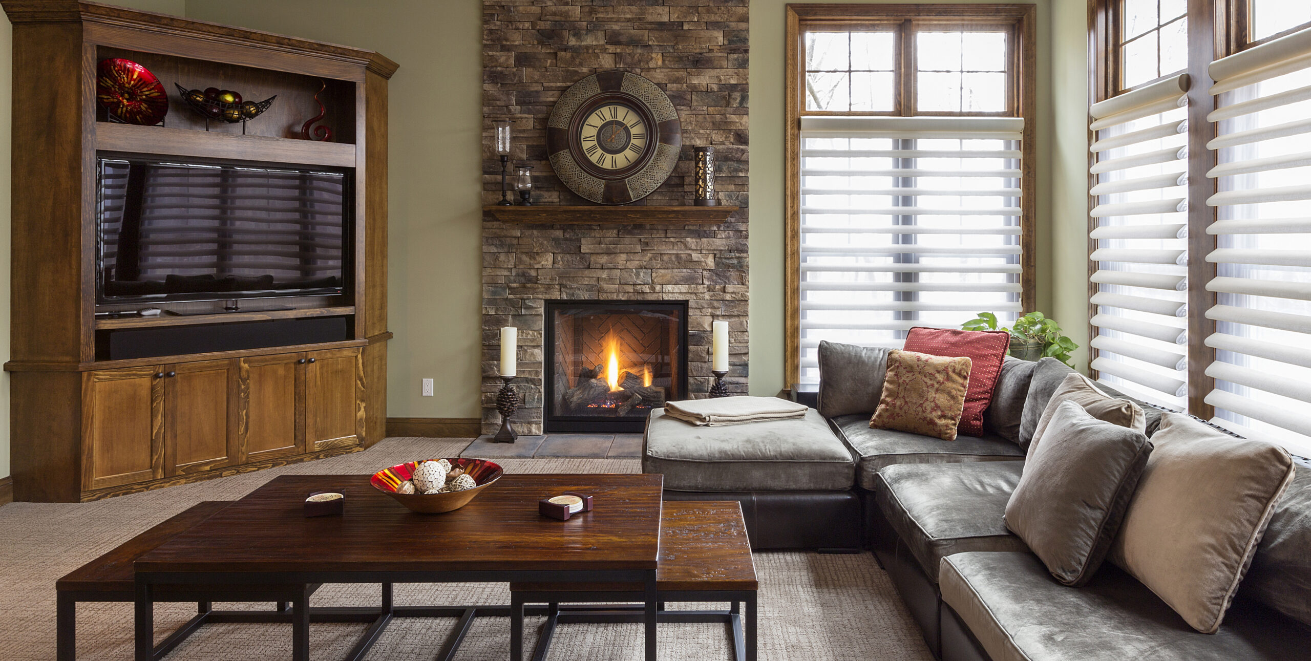 Sofa, television and fireplace in living room